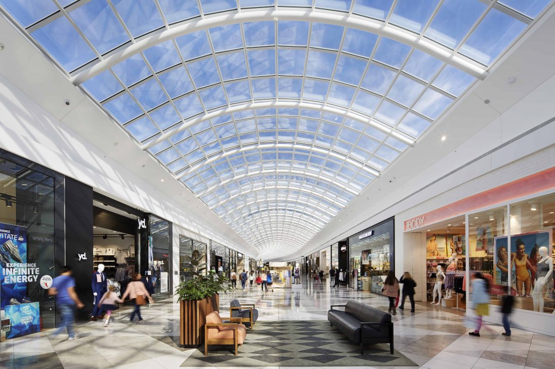 An interior shot of a bustling shopping centre, captured with expert precision by a professional photographer.