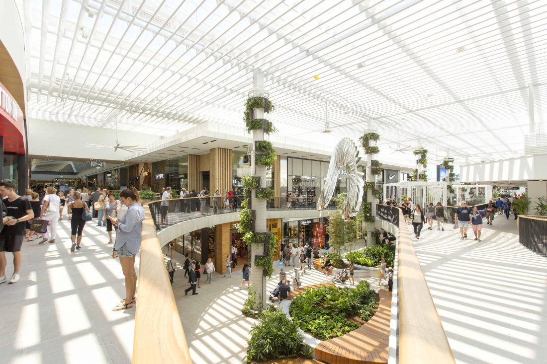 Retail store photography showcases the grandeur of a premium shopping centre space, featuring expansive atriums, designer boutiques, and elegant storefronts.