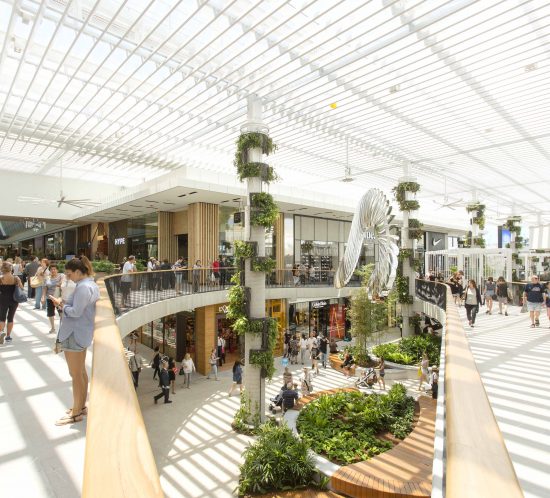 Retail store photography showcases the grandeur of a premium shopping centre space, featuring expansive atriums, designer boutiques, and elegant storefronts.