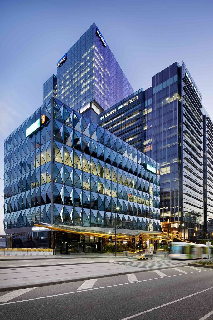 Exterior view of a sleek, contemporary office tower on Collins St in Melbourne.