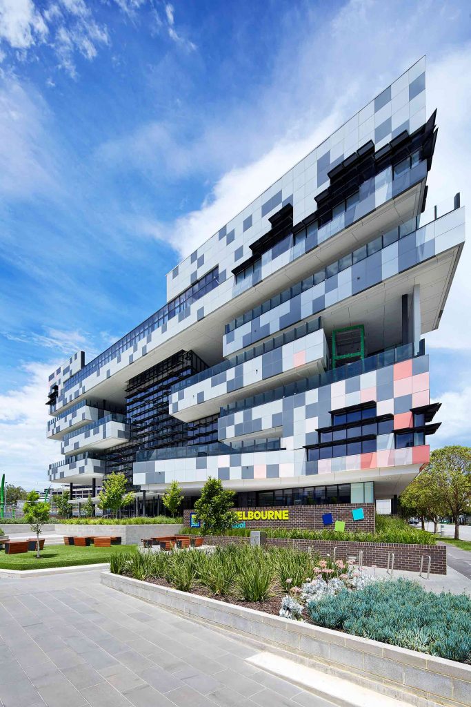 Exterior view of a sleek and contemporary vertical school building in Melbourne.