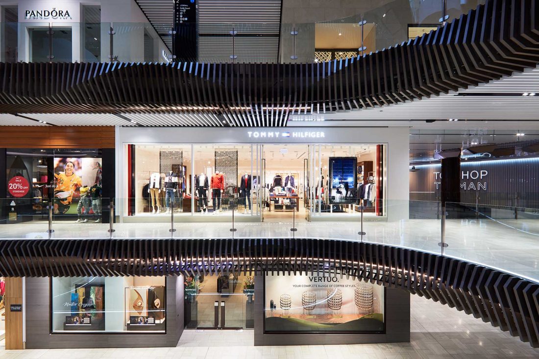 Exterior view of Tommy Hilfiger retail store in Melbourne, highlighting modern architectural design and captured through Melbourne architecture photography.