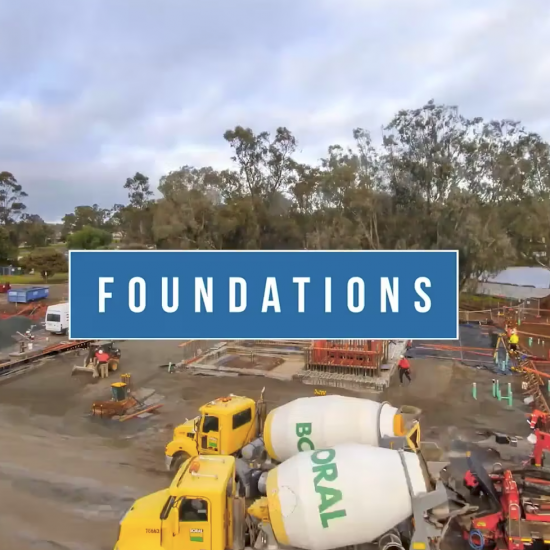 A construction video showing the process of building foundations, with workers and machinery in action.