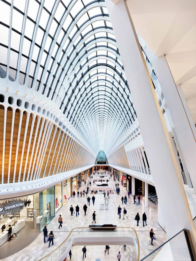 Interior view of a modern shopping centre mall with sleek design elements.