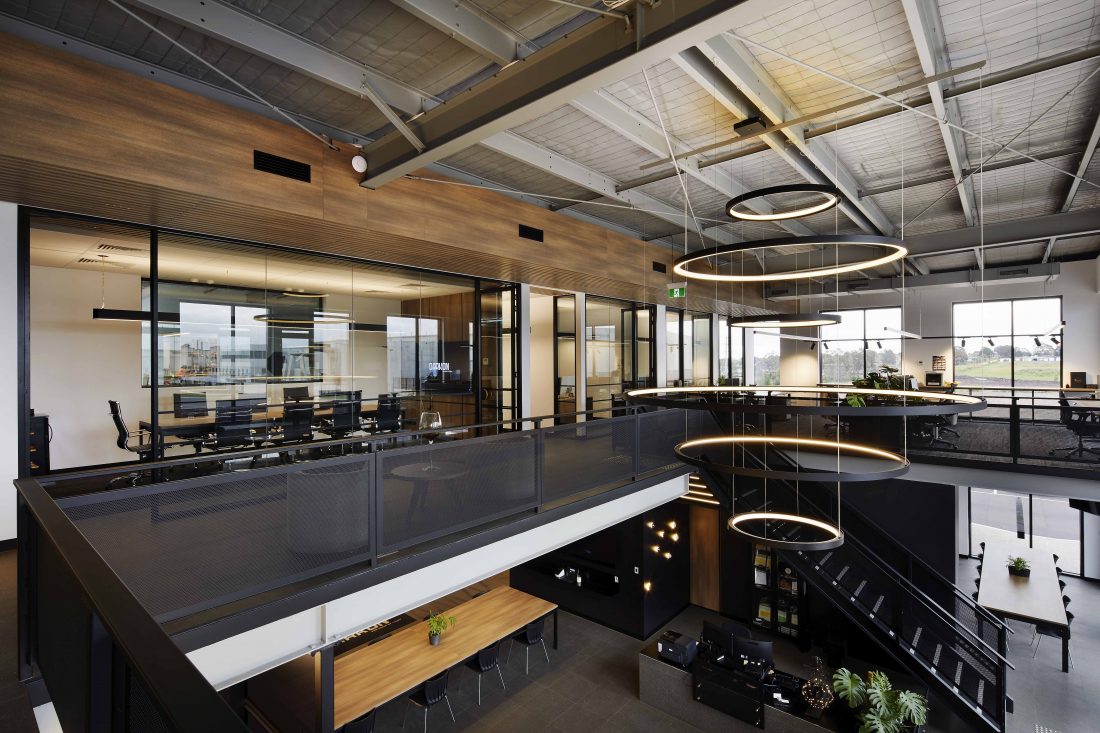 An image of a modern warehouse office interior in Melbourne, captured by interior photography, showcasing contemporary design elements and ample natural light.