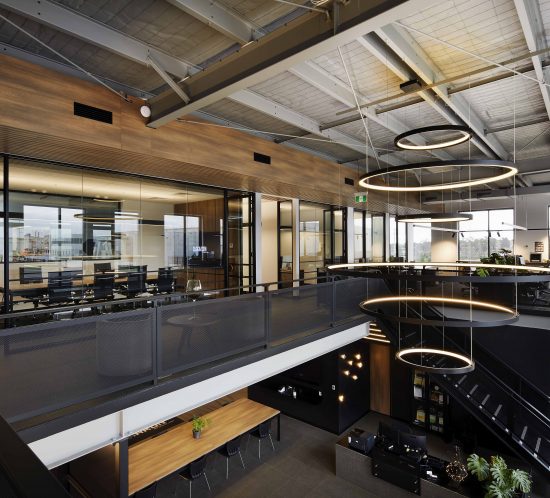 An image of a modern warehouse office interior in Melbourne, captured by interior photography, showcasing contemporary design elements and ample natural light.