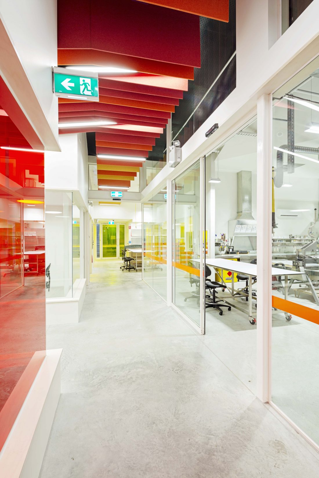 Interior architecture images of an art college showcasing soaring ceilings, vibrant colors, and expansive studio areas, capturing the creativity and inspiration of the space.