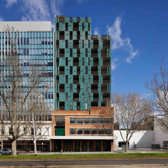 Commercial building photography. A modern apartment complex with striking architectural features in Melbourne.