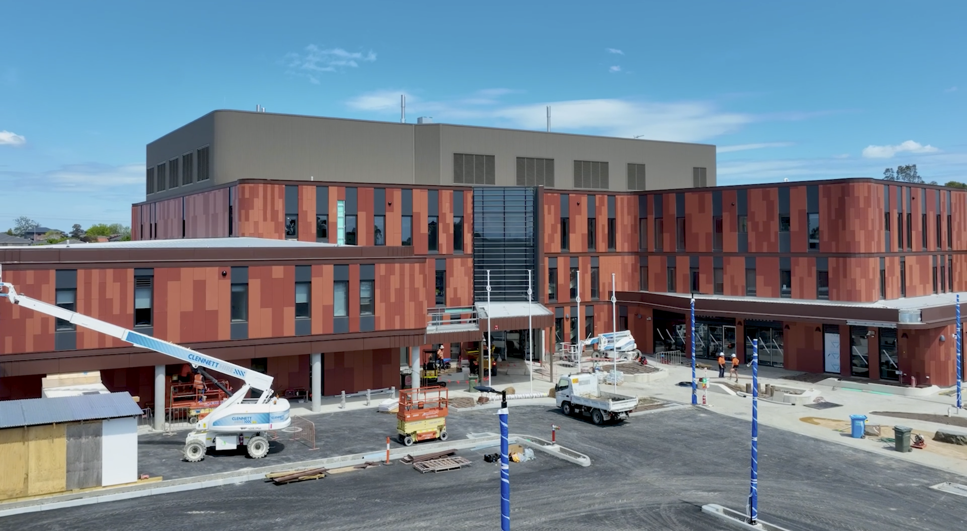 Aerial view of a construction project, showcasing progress with detailed site layout and structural developments captured in a construction project video.