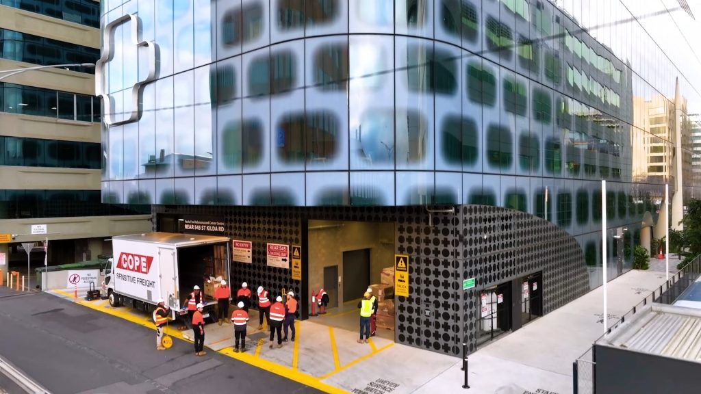 Aerial Drone Videography capturing workers outside the Paula Fox Melanoma and Cancer Centre at The Alfred Hospital.