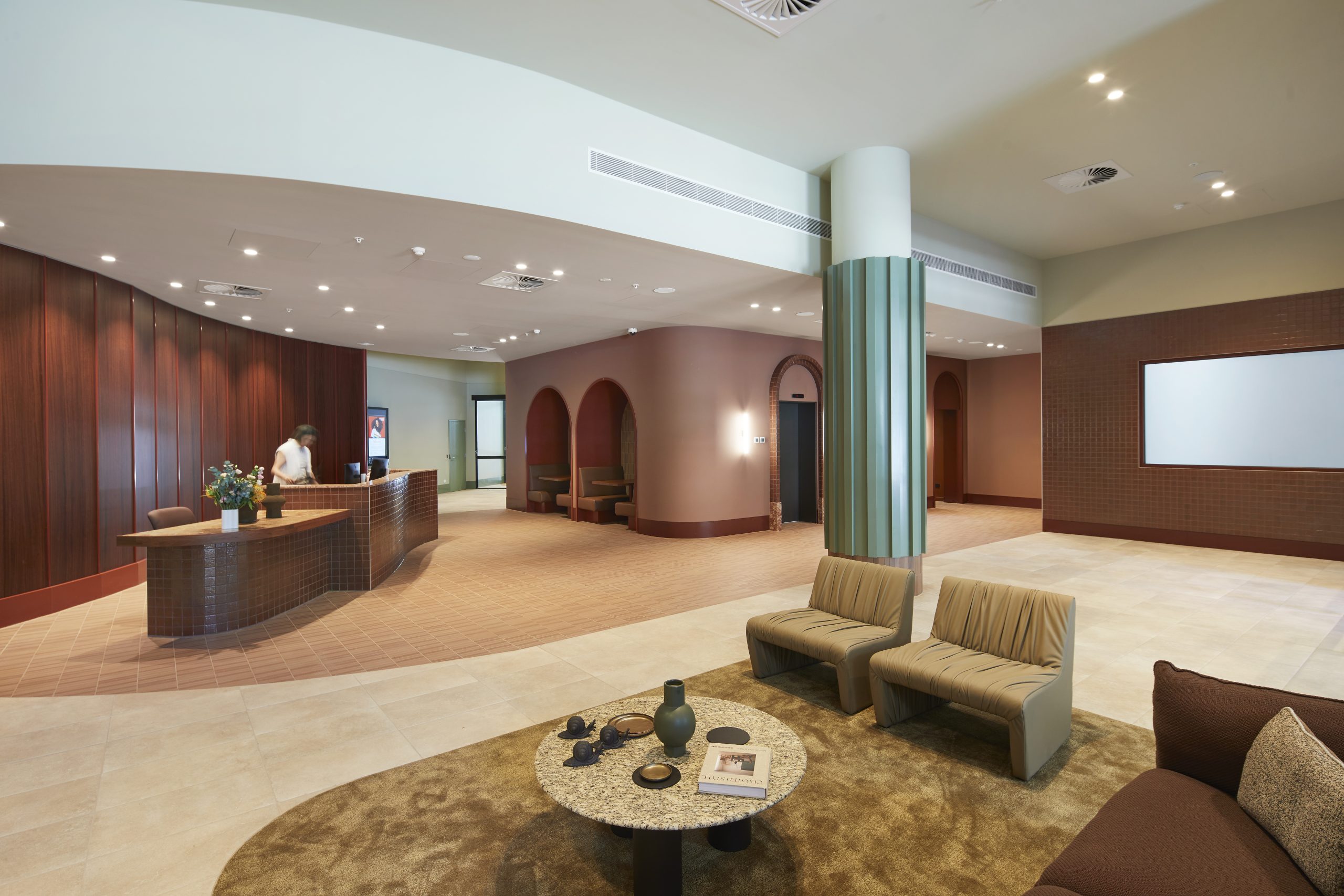 Spacious lobby with reception desk and sitting area, captured by a professional Interior Photographer in Melbourne.
